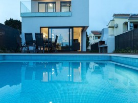 Luxury villa with private heated pool and sea view, only 100m from the beach