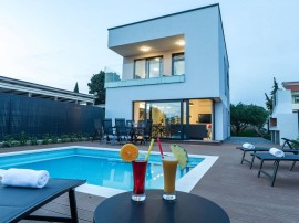 Luxury villa with private heated pool and sea view, only 100m from the beach